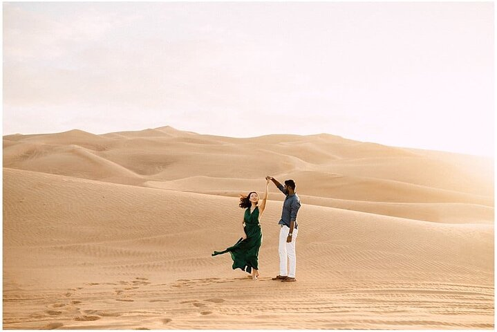 Discover the serene beauty of the Arabian desert perfect for families seeking adventure. Create lasting memories as you navigate the soft dunes together creating joyful moments under the sun.